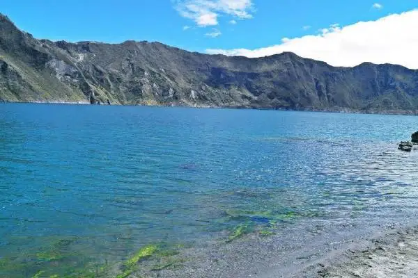 Quilotoa Lake depth and turquoise color close up view