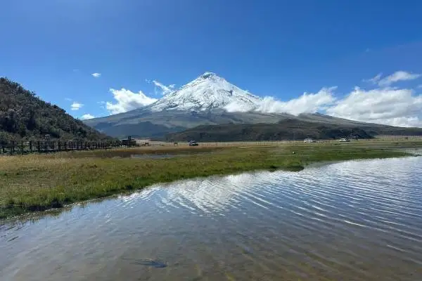 Hikers on the trail with views of Cotopaxi volcano, Ecuador