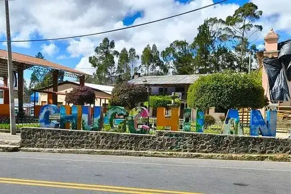 Colorful Chugchilan town sign along the main street