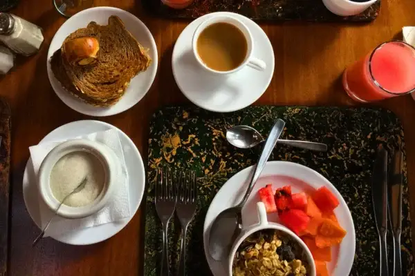 Breakfast spread with coffee, pastries, and fresh fruit served at Papallacta