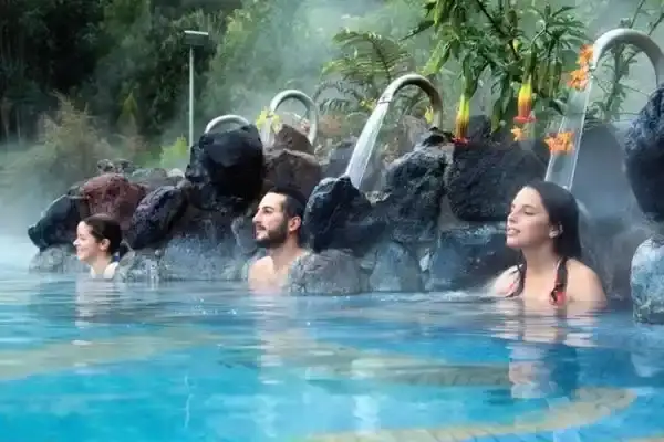 Travelers soak in Papallacta's steaming thermal pools, one side of the papallacta vs banos hot springs debate