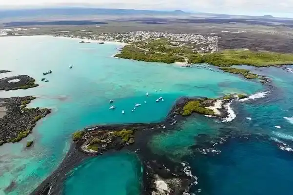 Aerial view of Puerto Villamil bay and the Tintoreras islet on Isabela