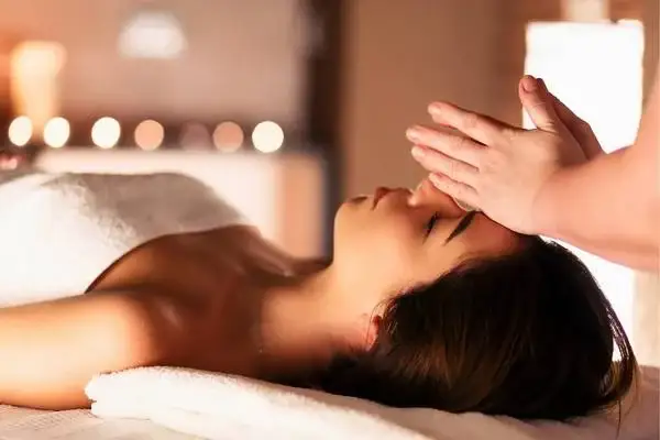 Woman receiving a relaxing facial massage at a spa near Papallacta hot springs
