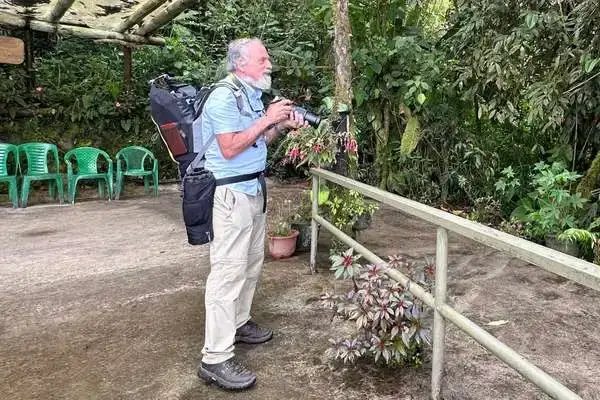 Birdwatcher photographer hummingbird watching Ecuador