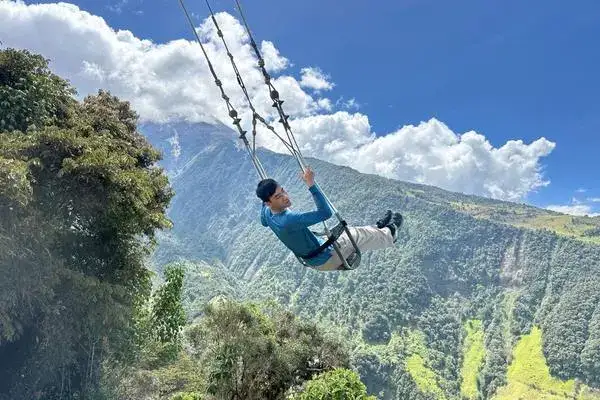 The swing at the end of the world in Baños — classic viewpoint for Tungurahua volcano