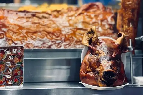 Traditional Ecuadorian food: roasted pork (hornado) at a local highland market