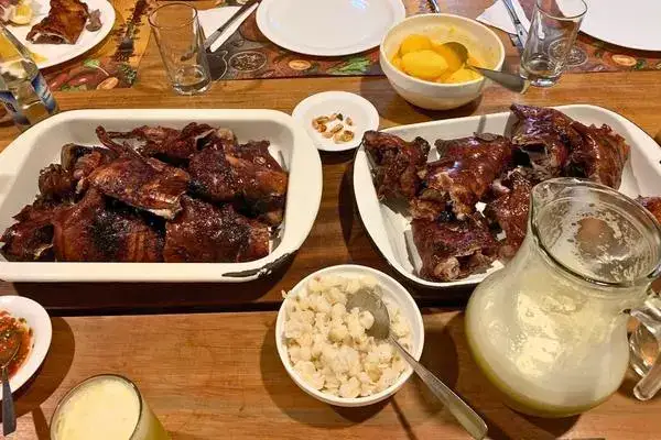 The traditional roasted guinea pig with corn and chicha