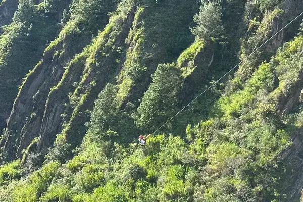 Ziplining across a canyon near Banos de Agua Santa Ecuador
