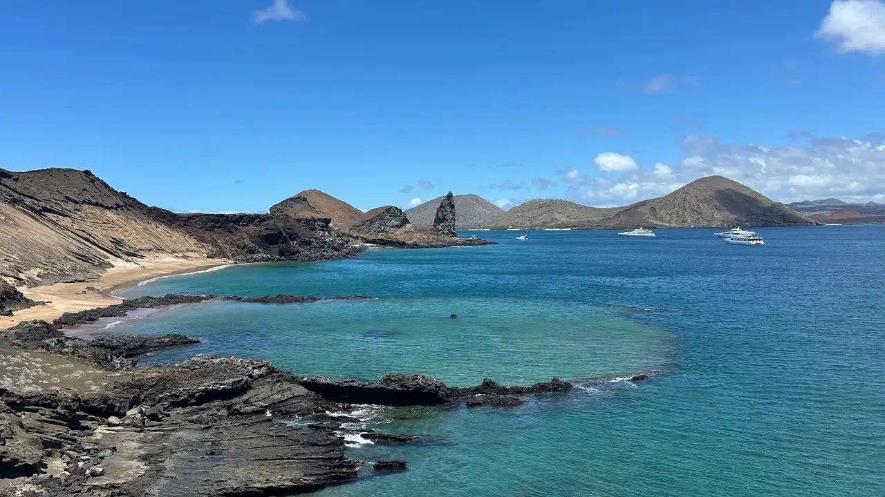 View from the summit of Bartolomé Island: Pinnacle Rock, a golden beach and turquoise water in the Galápagos